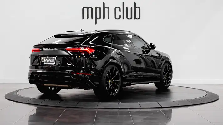 Black on yellow Lamborghini Urus rental rear view - mph club
