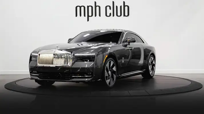 Dark grey Rolls Royce Spectre rental profile view rszd - mph club