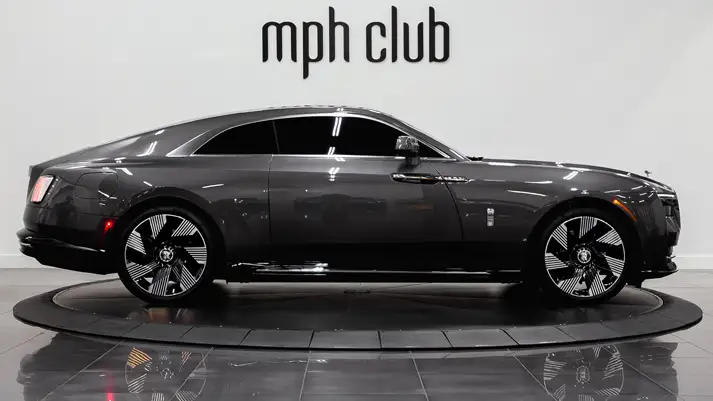 Dark grey Rolls Royce Spectre rental side view - mph club