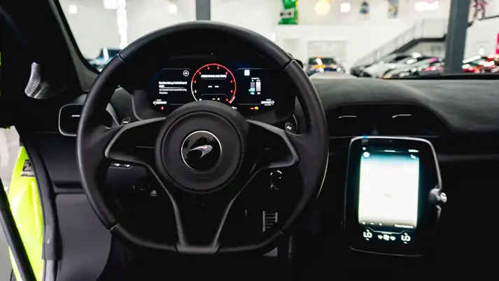 Green McLaren Artura for rent dashboard view - mph club
