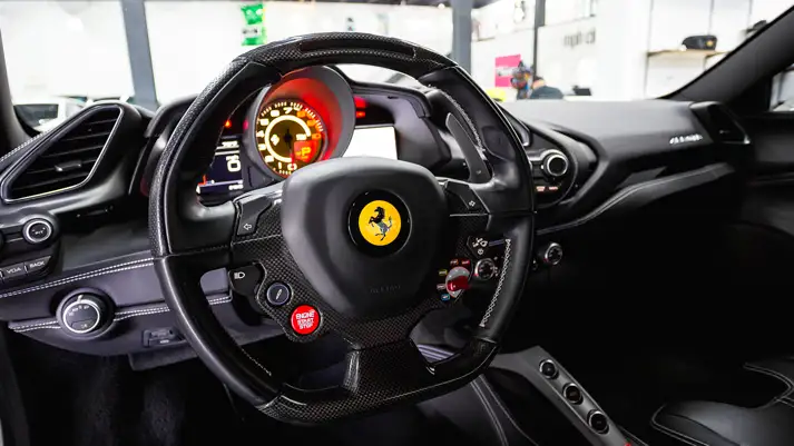White on black Ferrari 488 GTB rental dashboard view - mph club