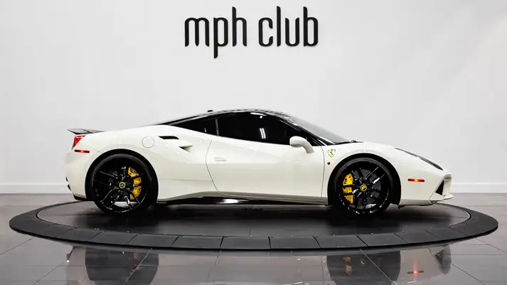 White on black Ferrari 488 GTB rental side view - mph club