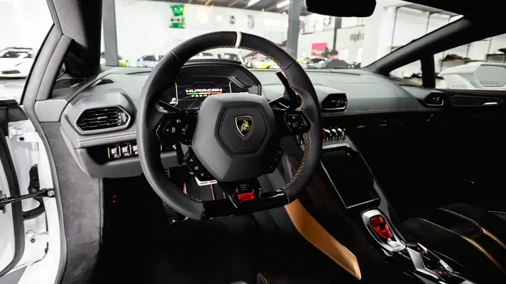 White on black Lamborghini Huracan Tecnica rental dashboard view - mph club