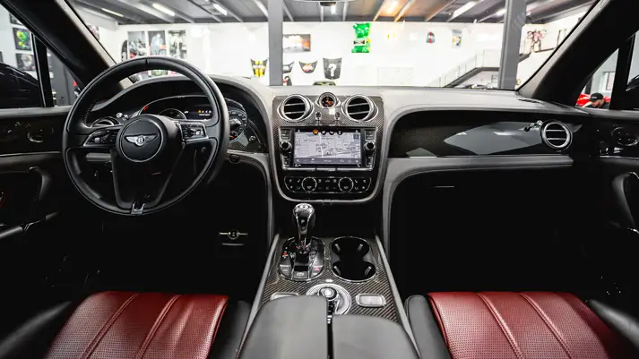 Black on red Bentley Bentayga rental dashboard view - mph club