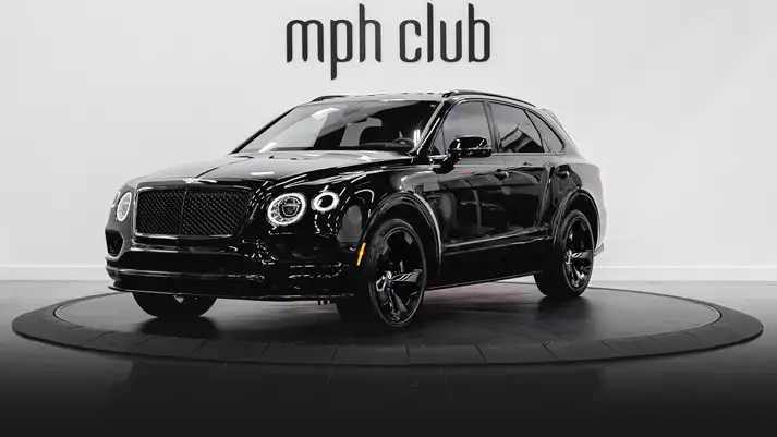 Black on red Bentley Bentayga rental profile view rszd - mph club