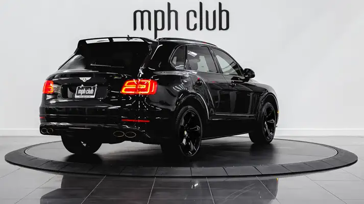 Black on red Bentley Bentayga rental rear view - mph club