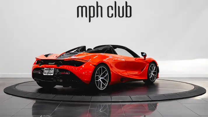 Orange McLaren 720s Spider rental rear view - mph club