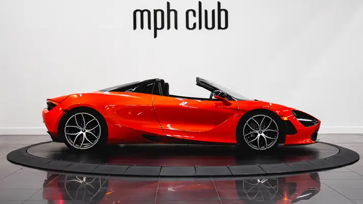 Orange McLaren 720s Spider rental side view - mph club
