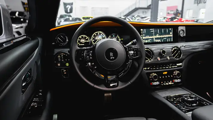 White on orange Rolls Royce Ghost dashboard view rental - mph club