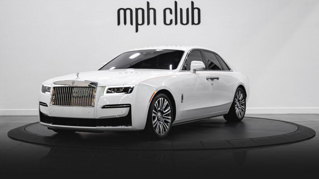 White on orange Rolls Royce Ghost profile view rental - mph club