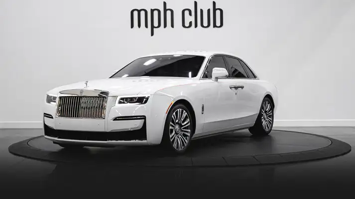 White on orange Rolls Royce Ghost profile view rental rszd - mph club