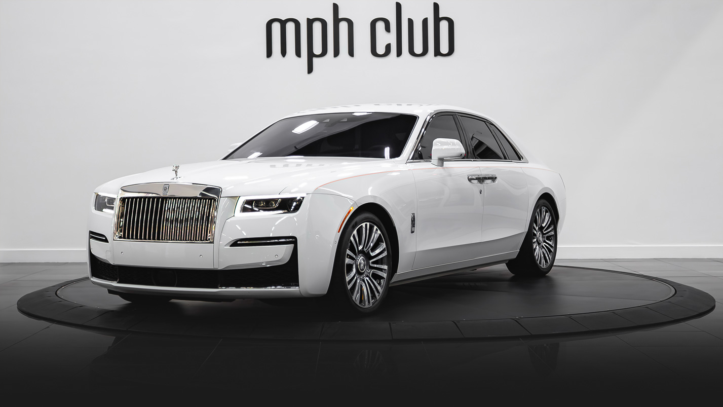 White on orange Rolls Royce Ghost profile view rental - mph club