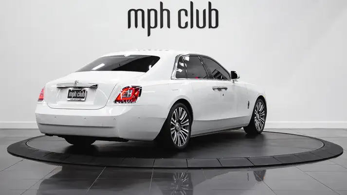 White on orange Rolls Royce Ghost rear view rental - mph club