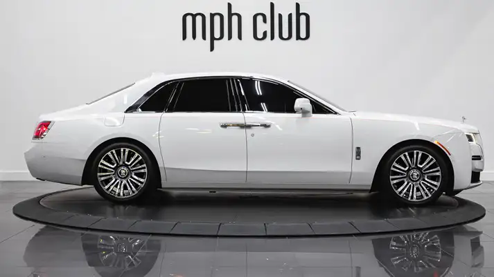 White on orange Rolls Royce Ghost side view rental - mph club