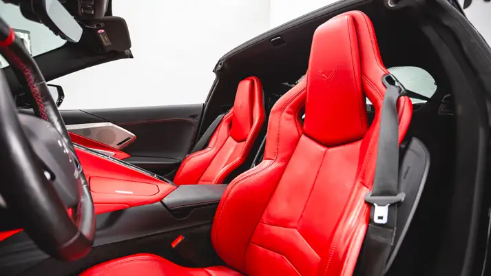 Black on red Corvette C8 rental interior view - mph club