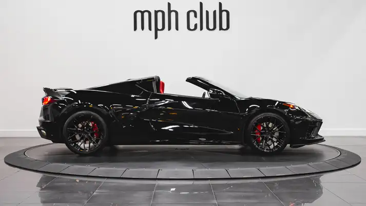 Black on red Corvette C8 rental side view - mph club