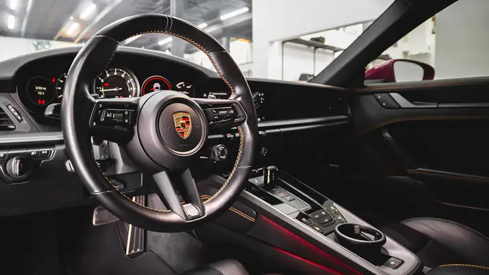 Pink Porsche 911 Carrera 4S rental dashboard view - mph club