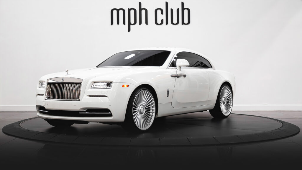 White on white Rolls Royce Wraith rental profile view - mph club