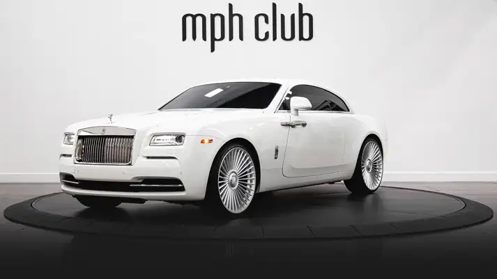 White on white Rolls Royce Wraith rental profile view - mph club rszd