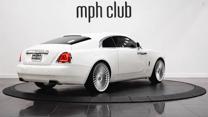 White on white Rolls Royce Wraith rental rear view - mph club