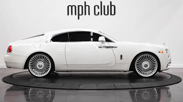 White on white Rolls Royce Wraith rental side view - mph club