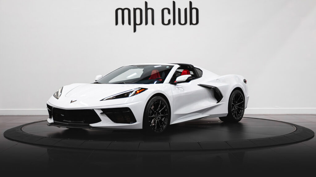 White with red Chevrolet Corvette C8 rental profile view - mph club