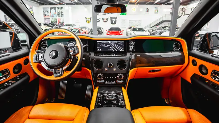 Black on orange interior Rolls Royce Cullinan Black Badge rental dashboard view - mph club