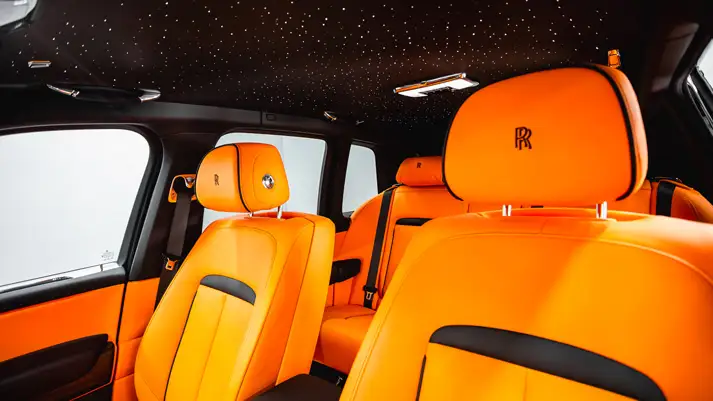 Black on orange interior Rolls Royce Cullinan Black Badge rental interior view - mph club