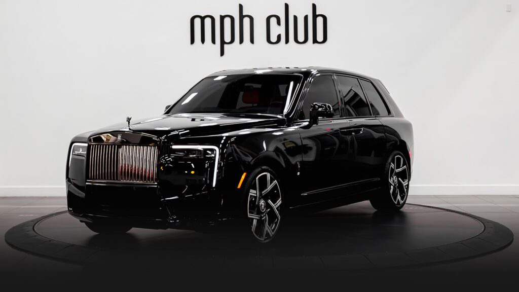 Black on orange interior Rolls Royce Cullinan Black Badge rental profile view - mph club