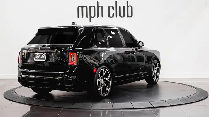 Black on orange interior Rolls Royce Cullinan Black Badge rental rear view - mph club