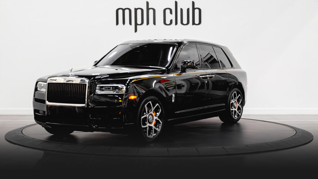 Black on orange Rolls Royce Cullinan rental profile view - mph club