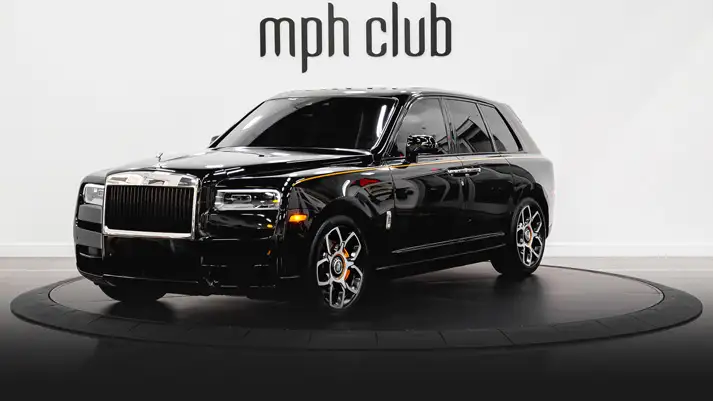 Black on orange Rolls Royce Cullinan rental profile view rszd - mph club