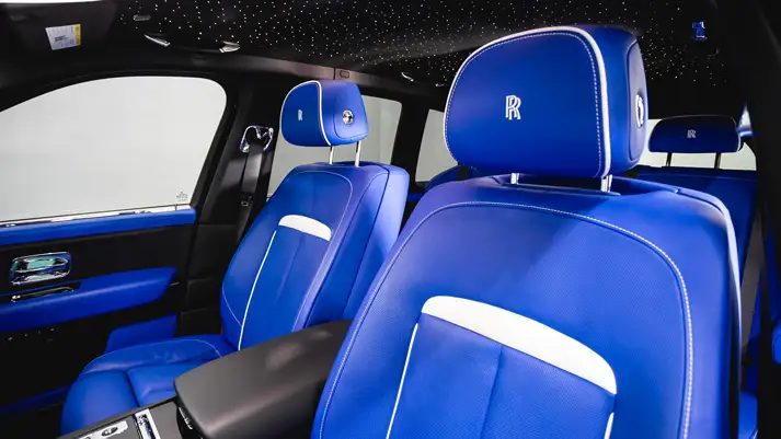 White on blue Rolls Royce Cullinan rental interior view - mph club