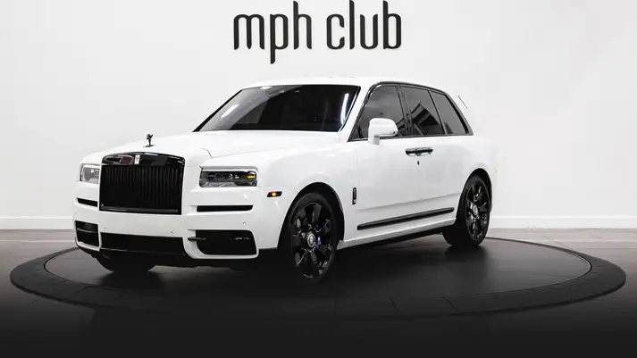White on blue Rolls Royce Cullinan rental profile view rszd - mph club
