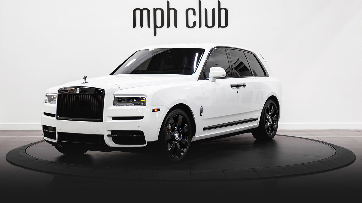 White on blue Rolls Royce Cullinan rental profile view - mph club