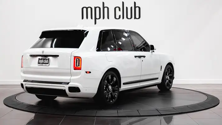 White on blue Rolls Royce Cullinan rental rear view - mph club