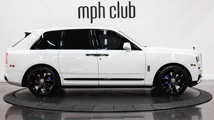 White on blue Rolls Royce Cullinan rental side view - mph club