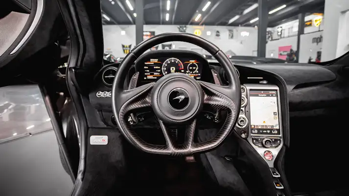 Black on black McLaren 720s Spider rental dashboard view - mph club