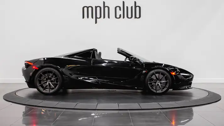Black on black McLaren 720s Spider rental side view - mph club