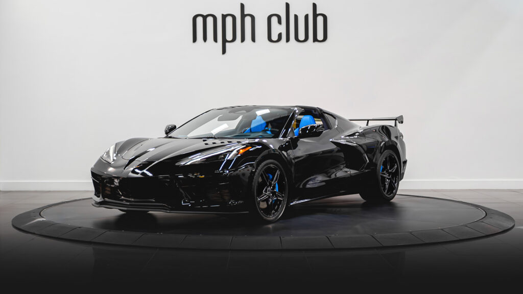 Black on blue Chevrolet Corvette C8 rental profile view - mph club