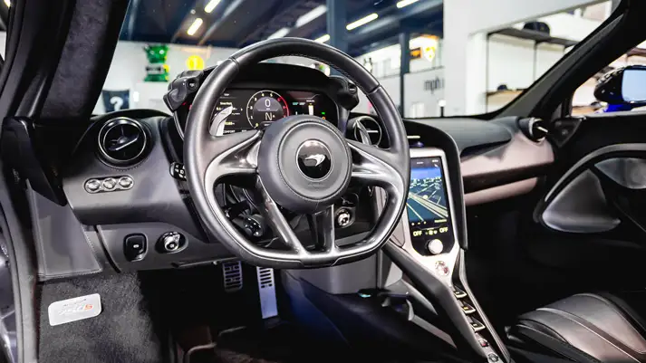 Blue McLaren 750s rental dashboard view - mph club