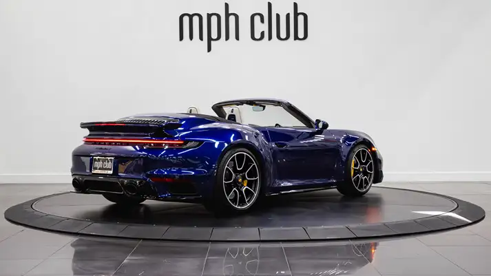 Blue Porsche 911 Turbo S rental rear view - mph club