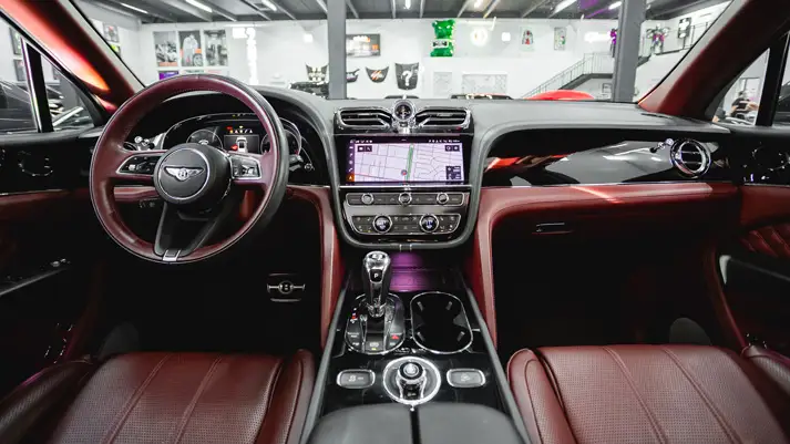 Grey on red Bentley Bentayga rental dashboard view - mph club