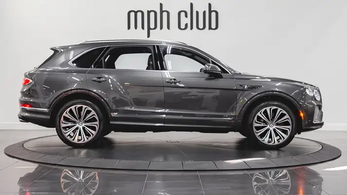 Grey on red Bentley Bentayga rental side view - mph club