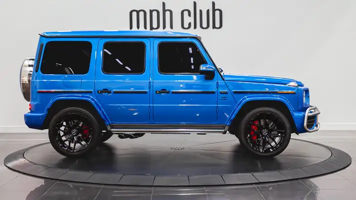 Lite blue Mercedes Benz G63 rental side view - mph club