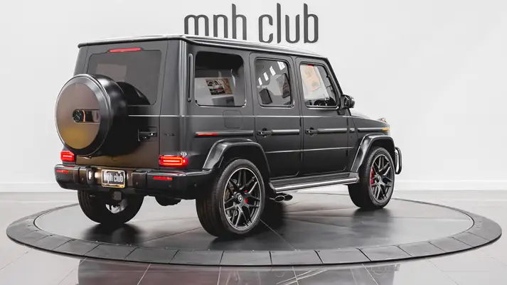 Matte black on black Mercedes Benz G63 AMG G Wagon rental rear view - mph club