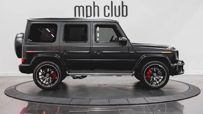 Matte black on black Mercedes Benz G63 AMG G Wagon rental side view - mph club