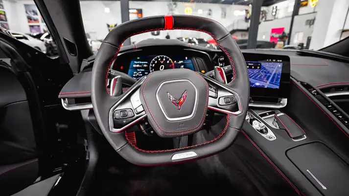 Black Chevrolet Corvette Z06 rental dashboard view - mph club