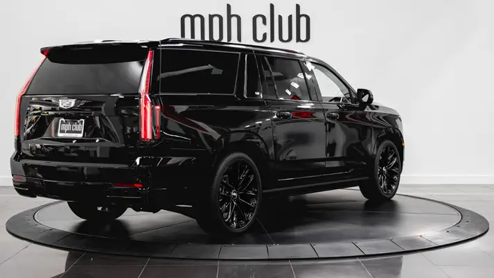 Black on black Cadillac Escalade ESV rental rear view - mph club