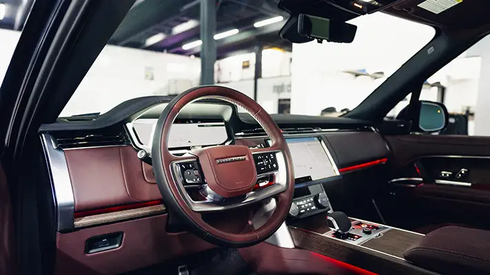 Blue Range Rover rental Miami dashboard view - mph club